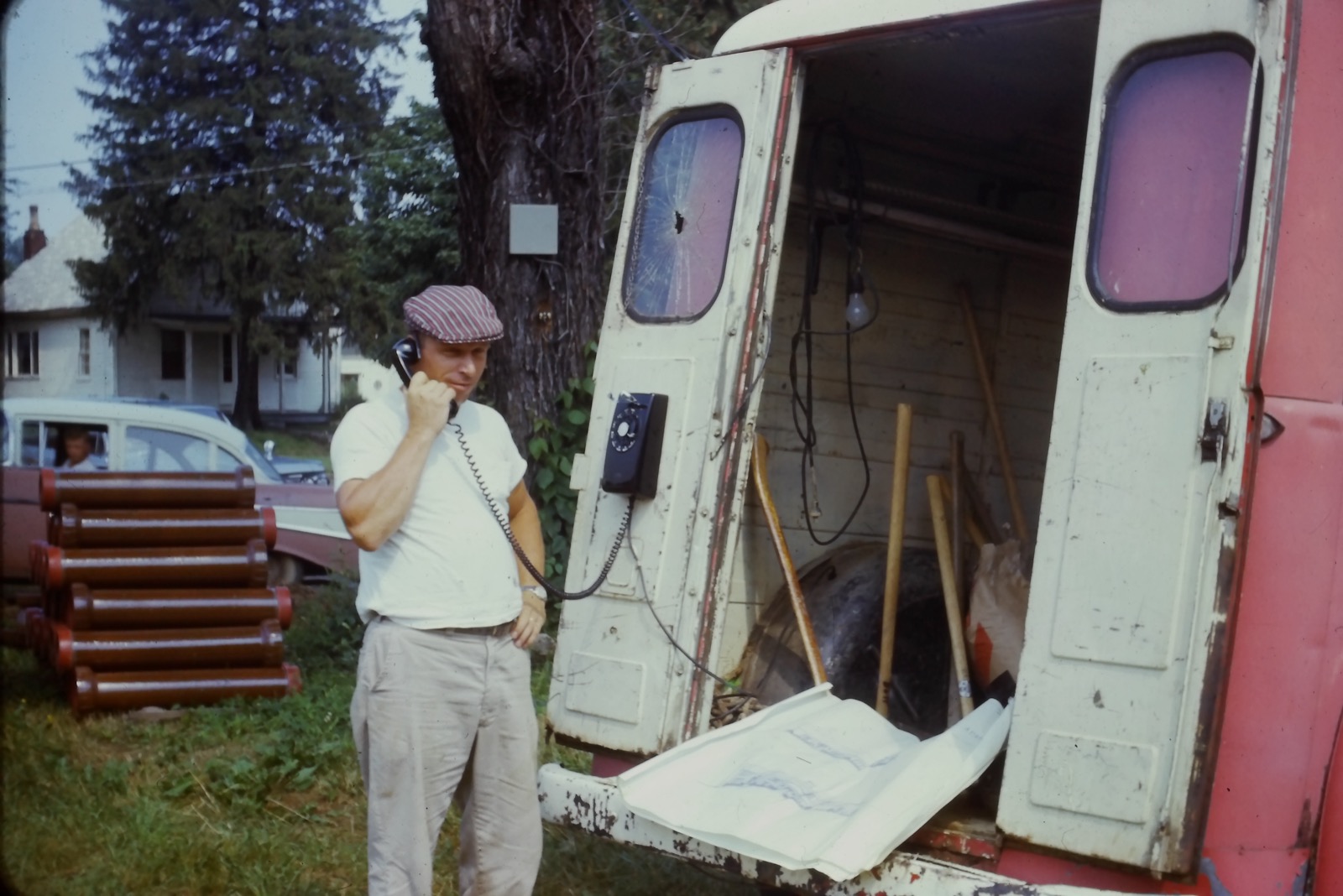 Grandfather on the phone at the job site — the original mobile phone, 1963
