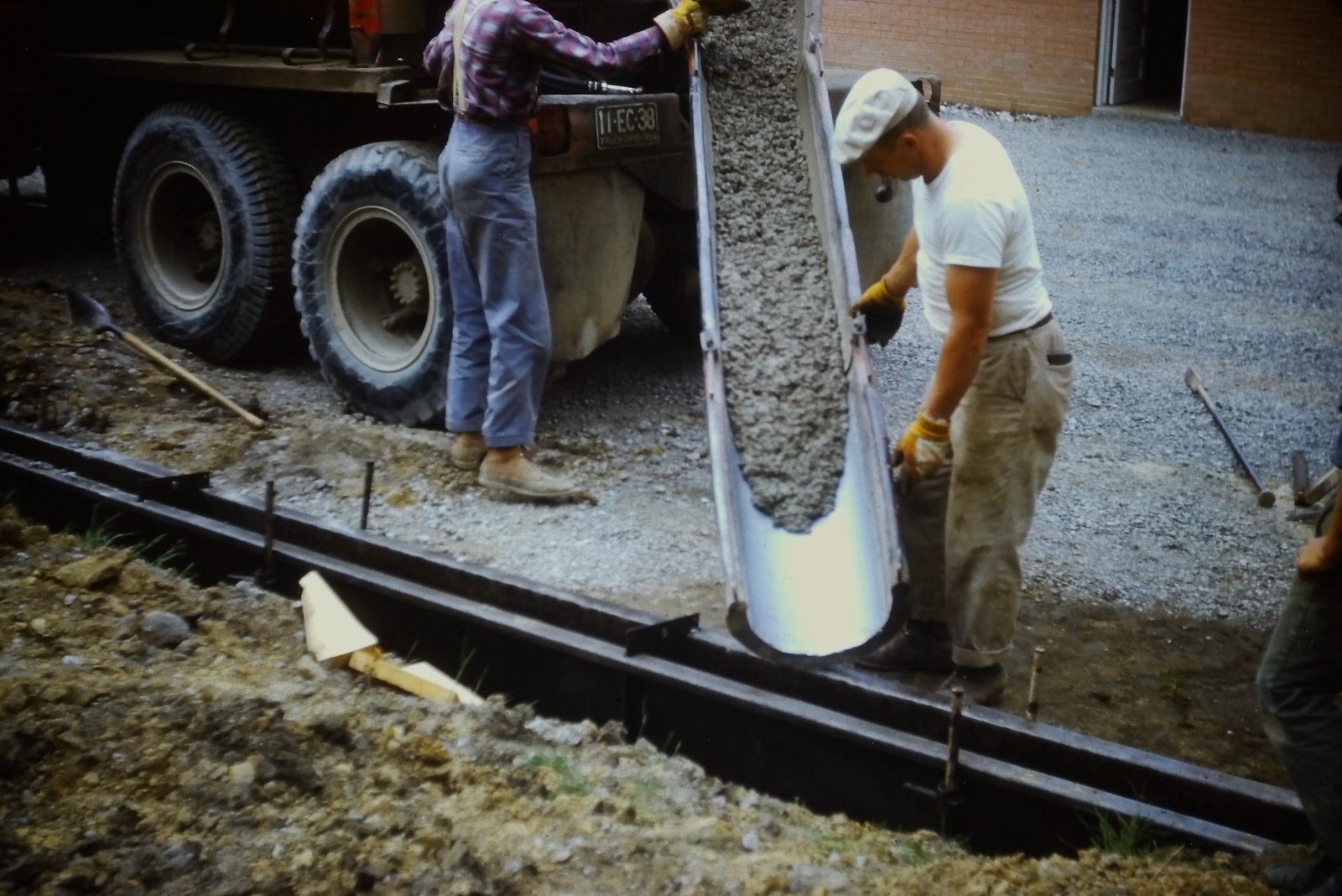 Grandfather pouring concrete, 1964